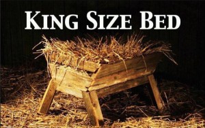 A picture of a manger filled with straw, with the caption "KING SIZE BED"