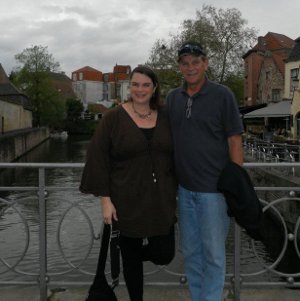 Michelle and her dad, standing on a bridge above a canal in Brugge, Belgium